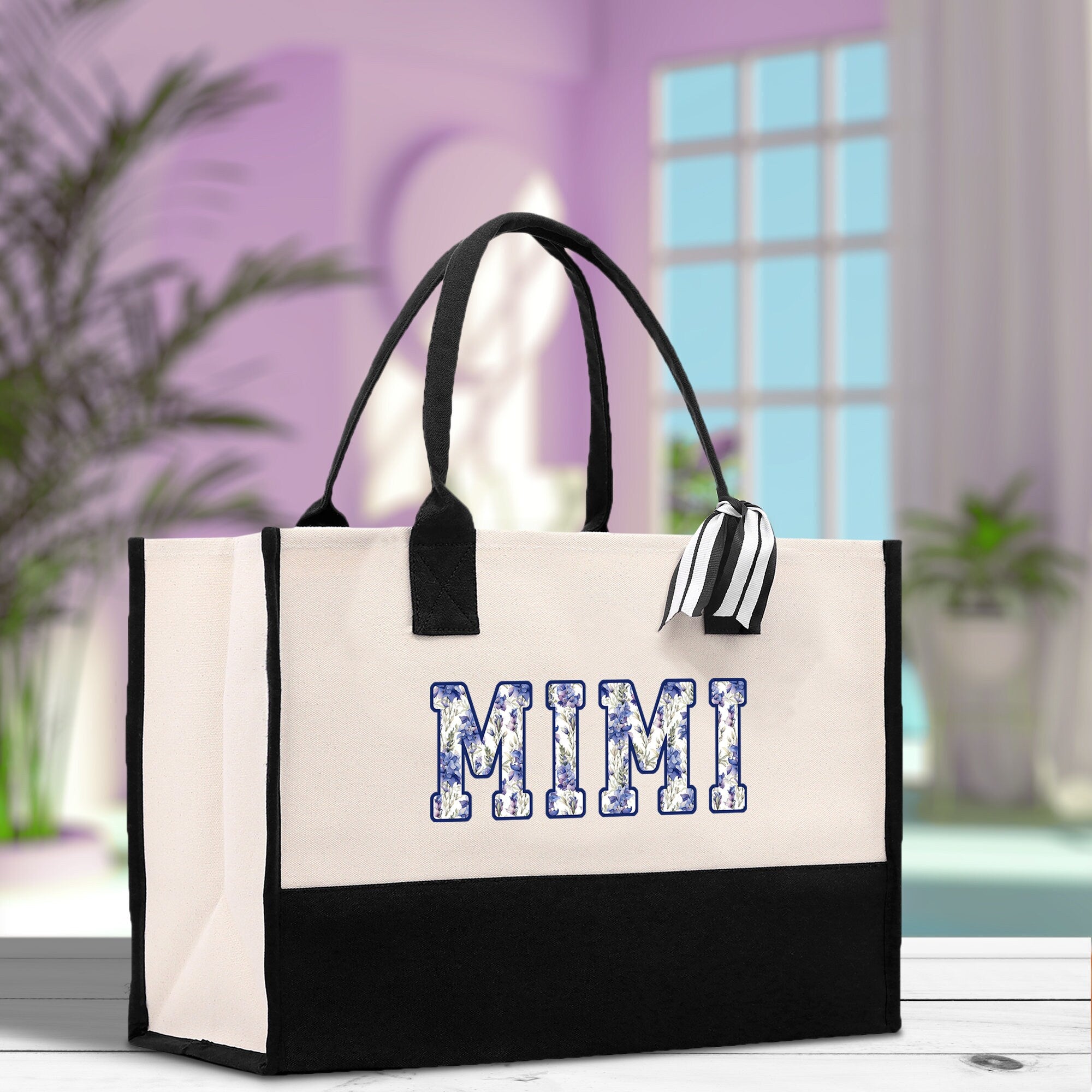 a white and black bag with the word mimi on it