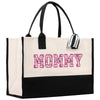 a black and white tote bag with the word mommy printed on it