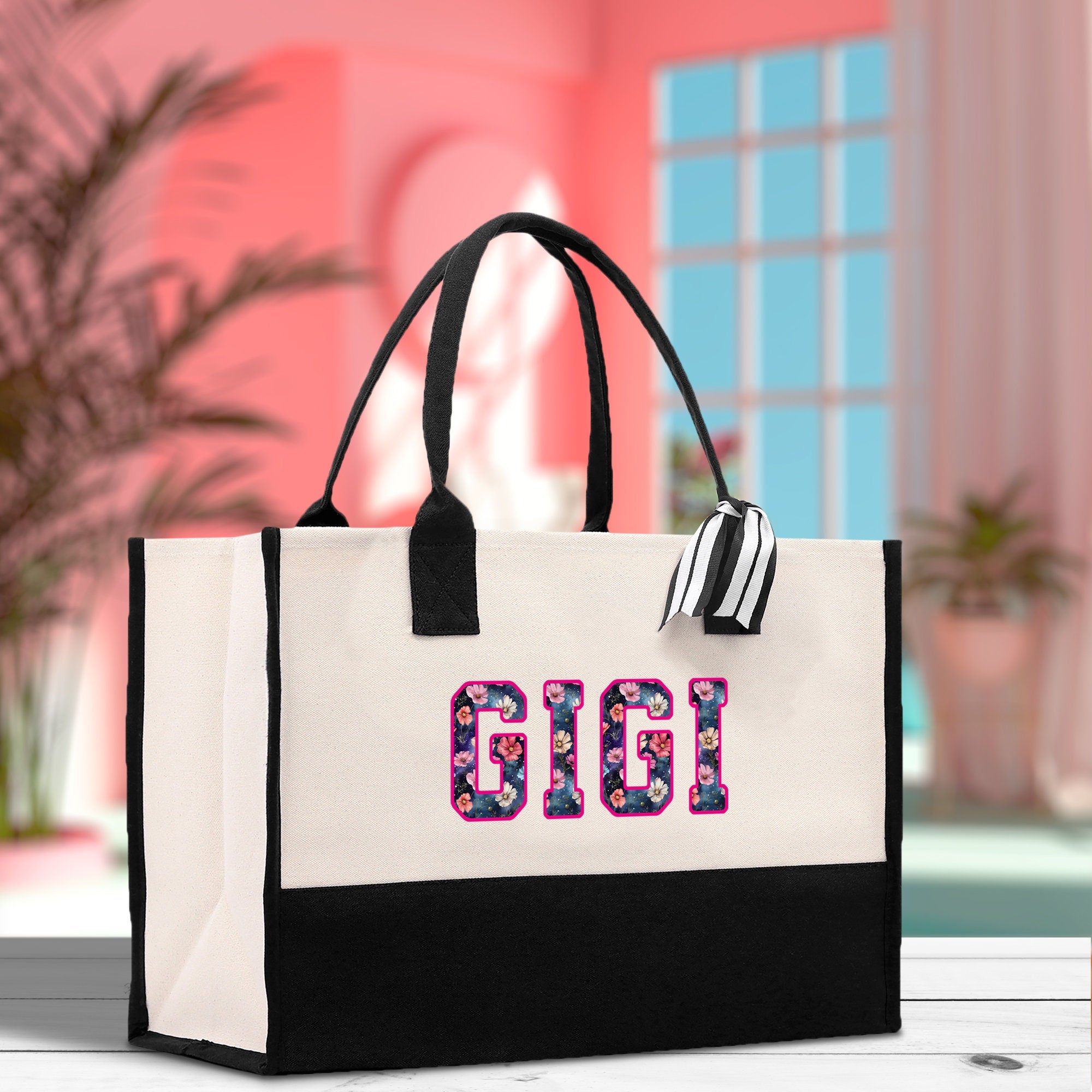 a black and white bag with a pink and white design