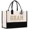 a black and white bag with the word gran printed on it