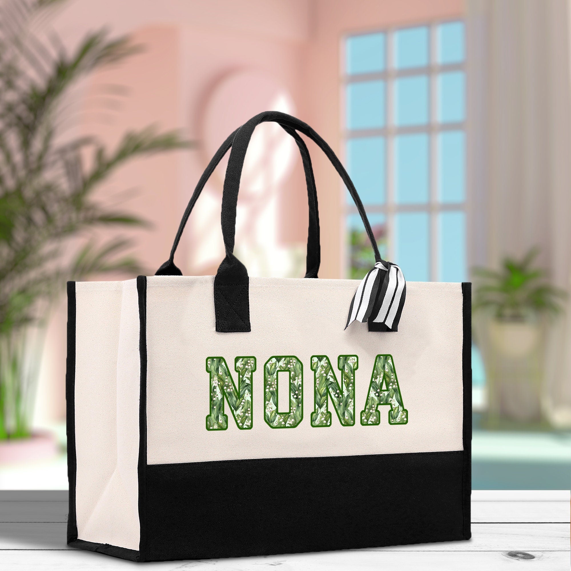 a black and white bag with the word nona on it