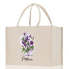 a white shopping bag with purple flowers on it