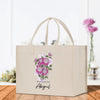 a shopping bag with a bouquet of flowers on it
