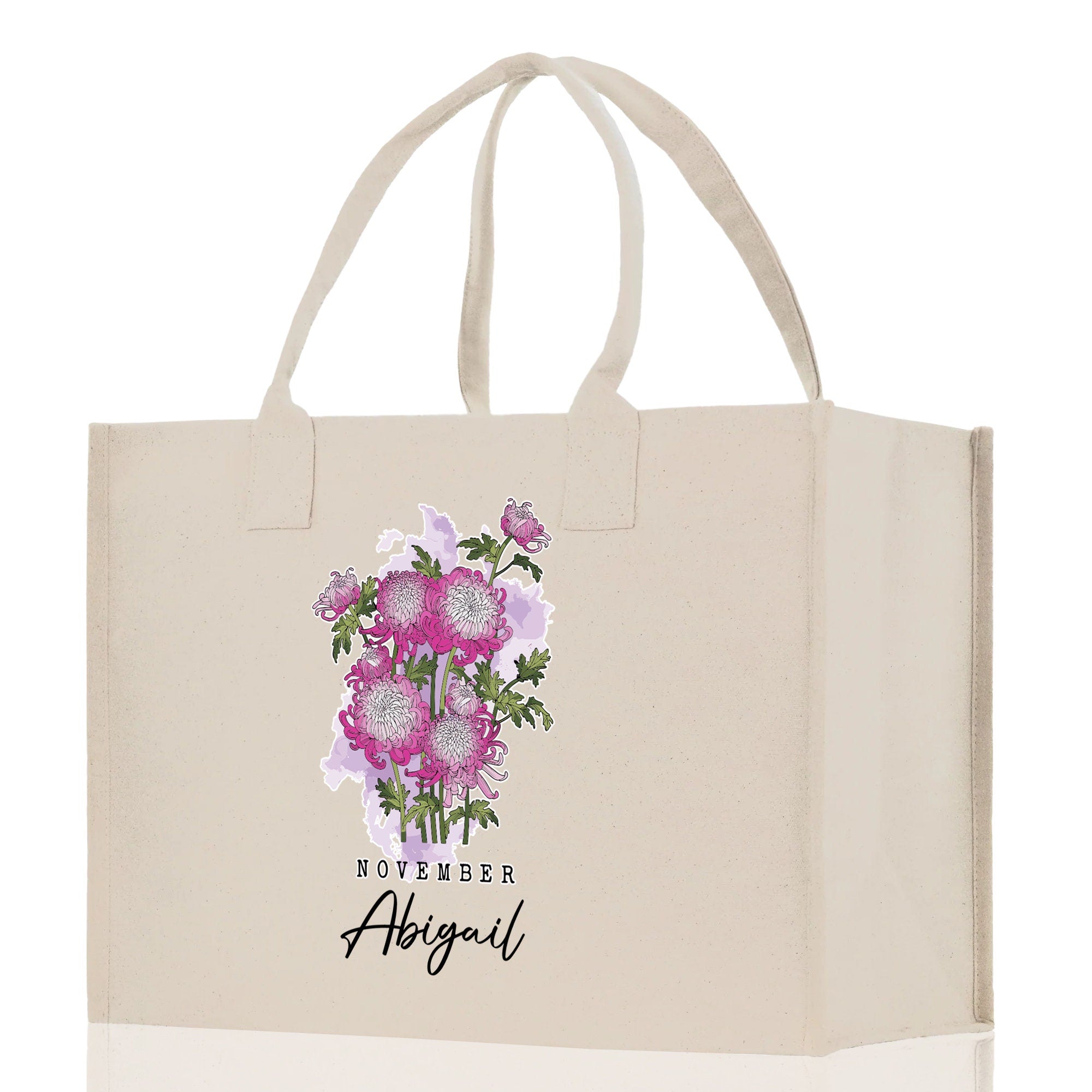 a white shopping bag with pink flowers on it