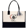 a black and white bag with a dog's paw on it