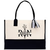 a black and white tote bag with a bow