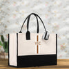 a white and black bag with a cross on it