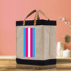 a canvas bag with a pink, blue, and white stripe on it