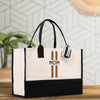 a black and white bag with a cross on it