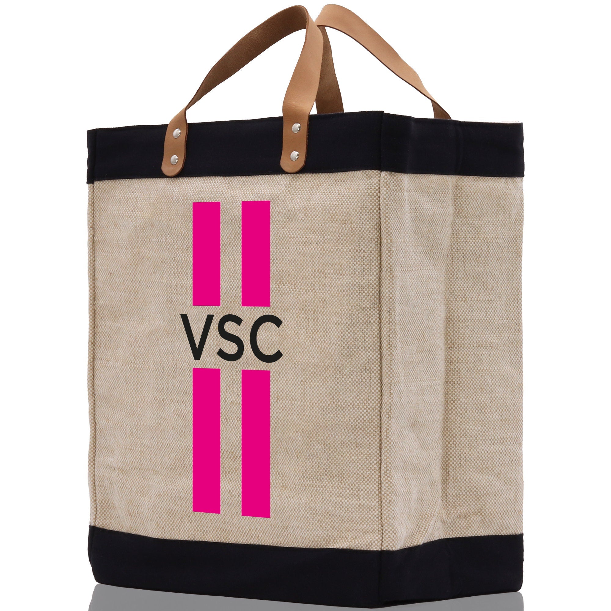 a canvas tote bag with pink and black stripes