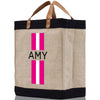 a jute bag with a pink and white stripe on it