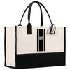 a black and white tote bag with a striped handle