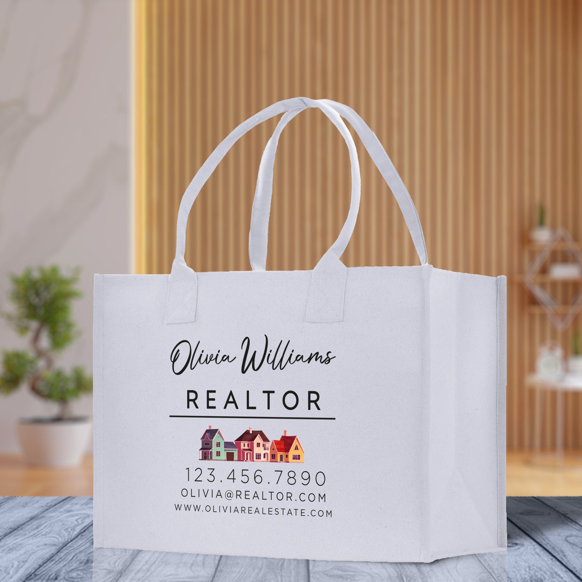 a white bag with a realtor logo on it