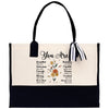 a black and white tote bag with the words you are surrounded by flowers