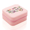 a pink box with a floral design on it