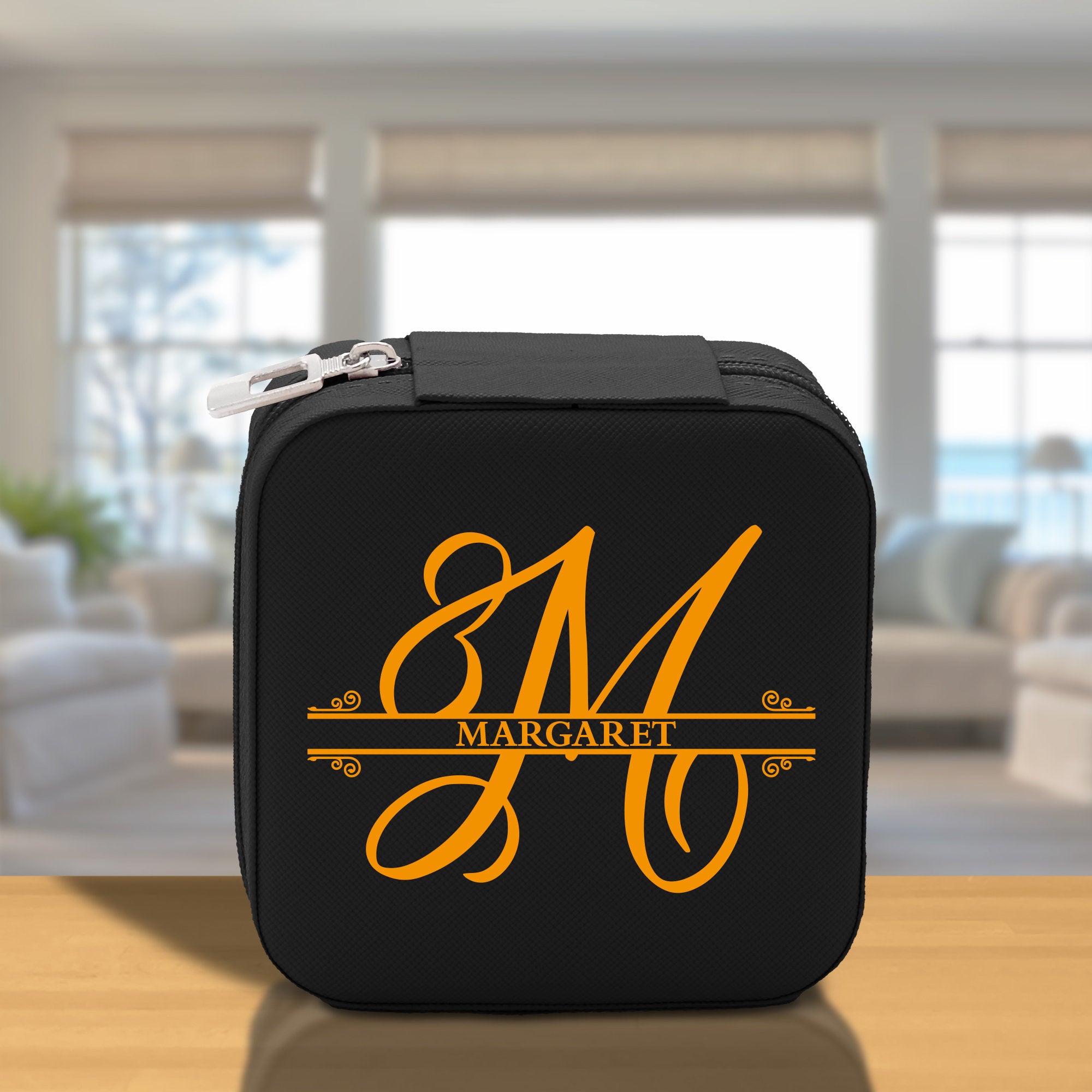 a black case with a yellow monogrammed m on it