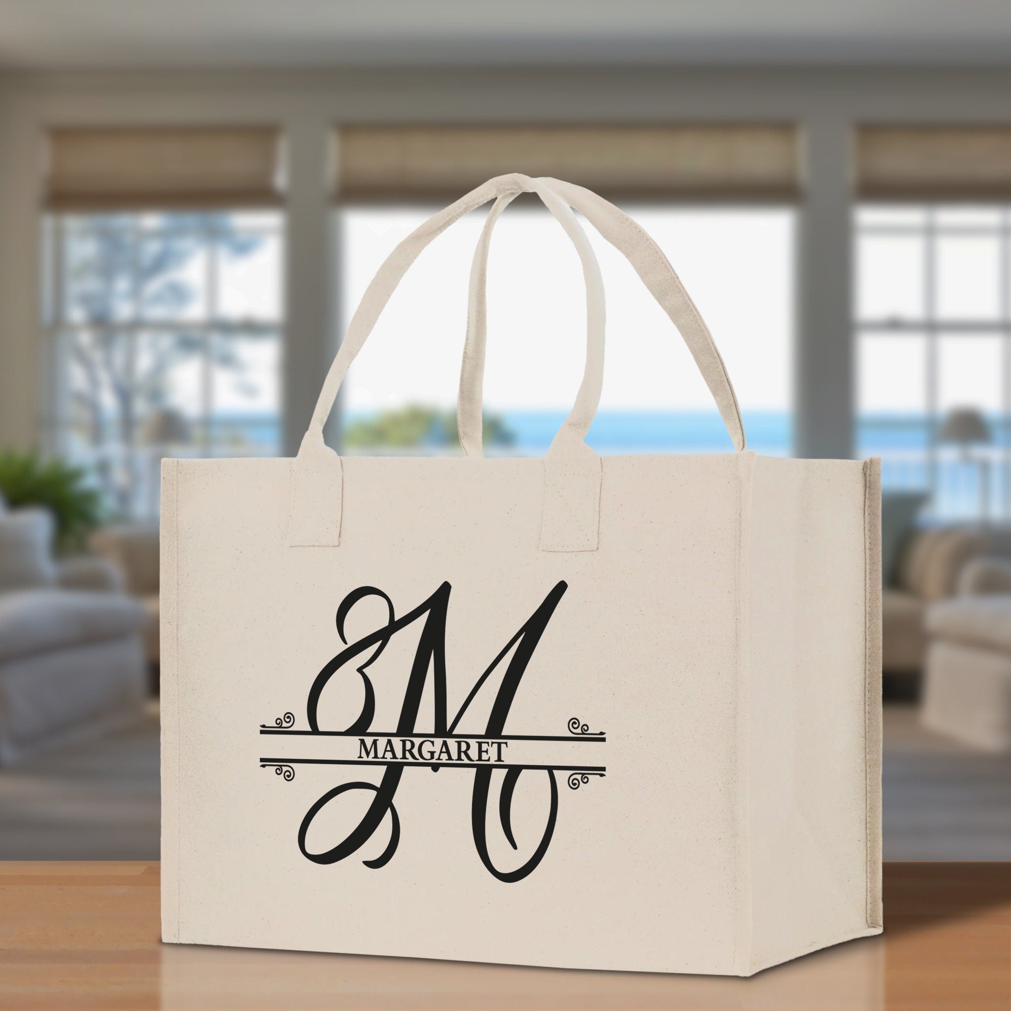 a white shopping bag with a monogrammed m on it