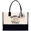 a black and white bag with a tassel hanging from it