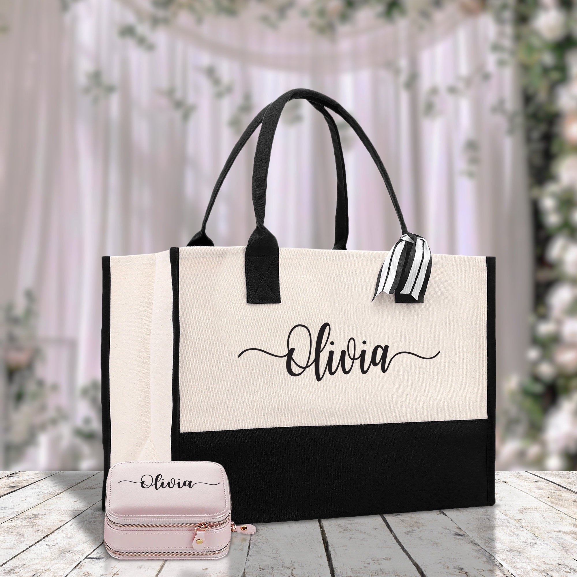 a white and black bag with a name on it