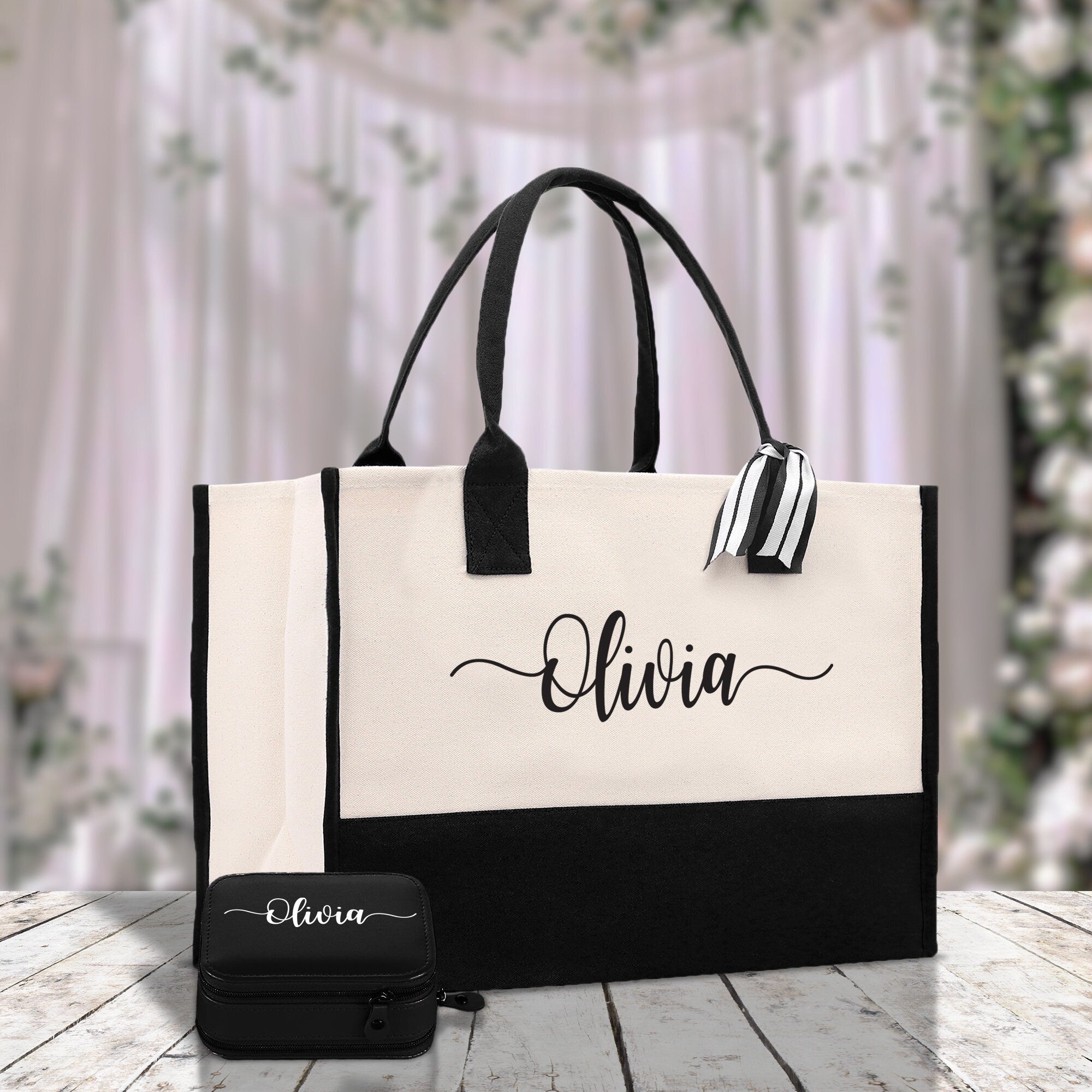 a black and white bag with a name on it