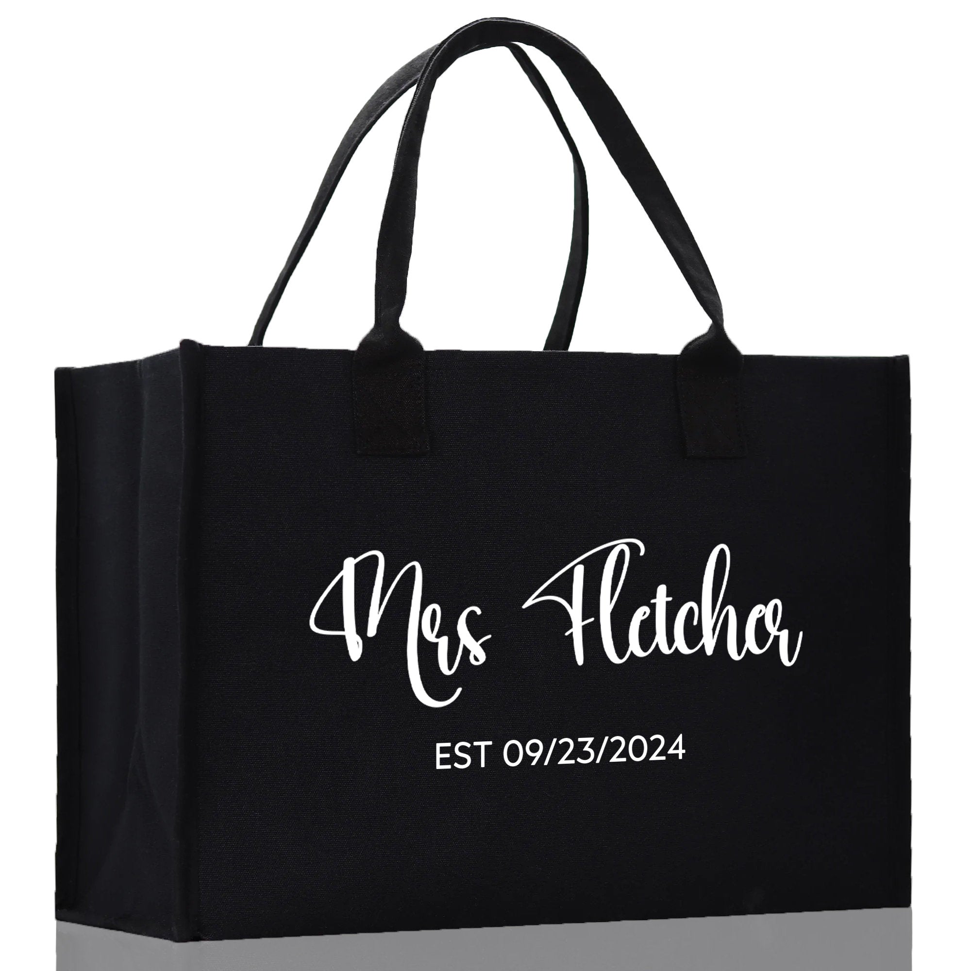 a black shopping bag with the name of the shop