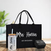 a black tote bag with a drink and a personalized tote bag