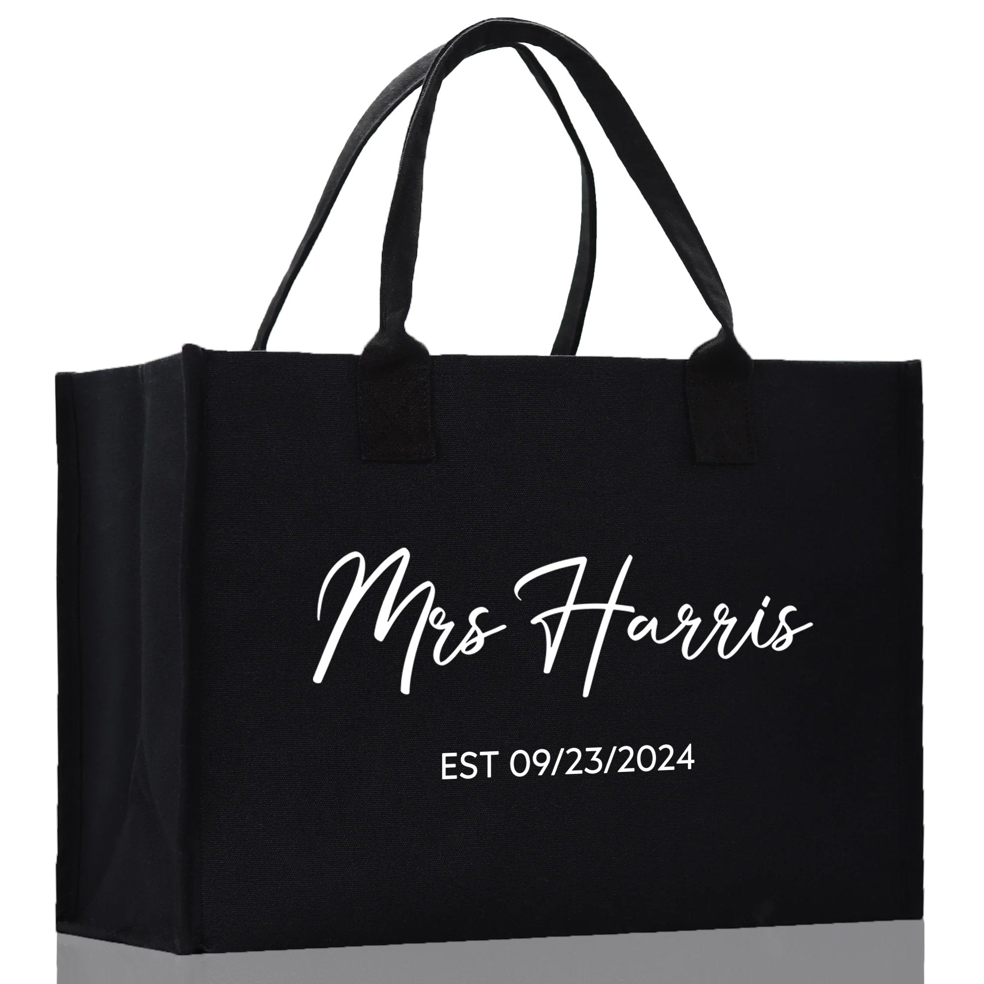 a black shopping bag with the words mrs harris on it