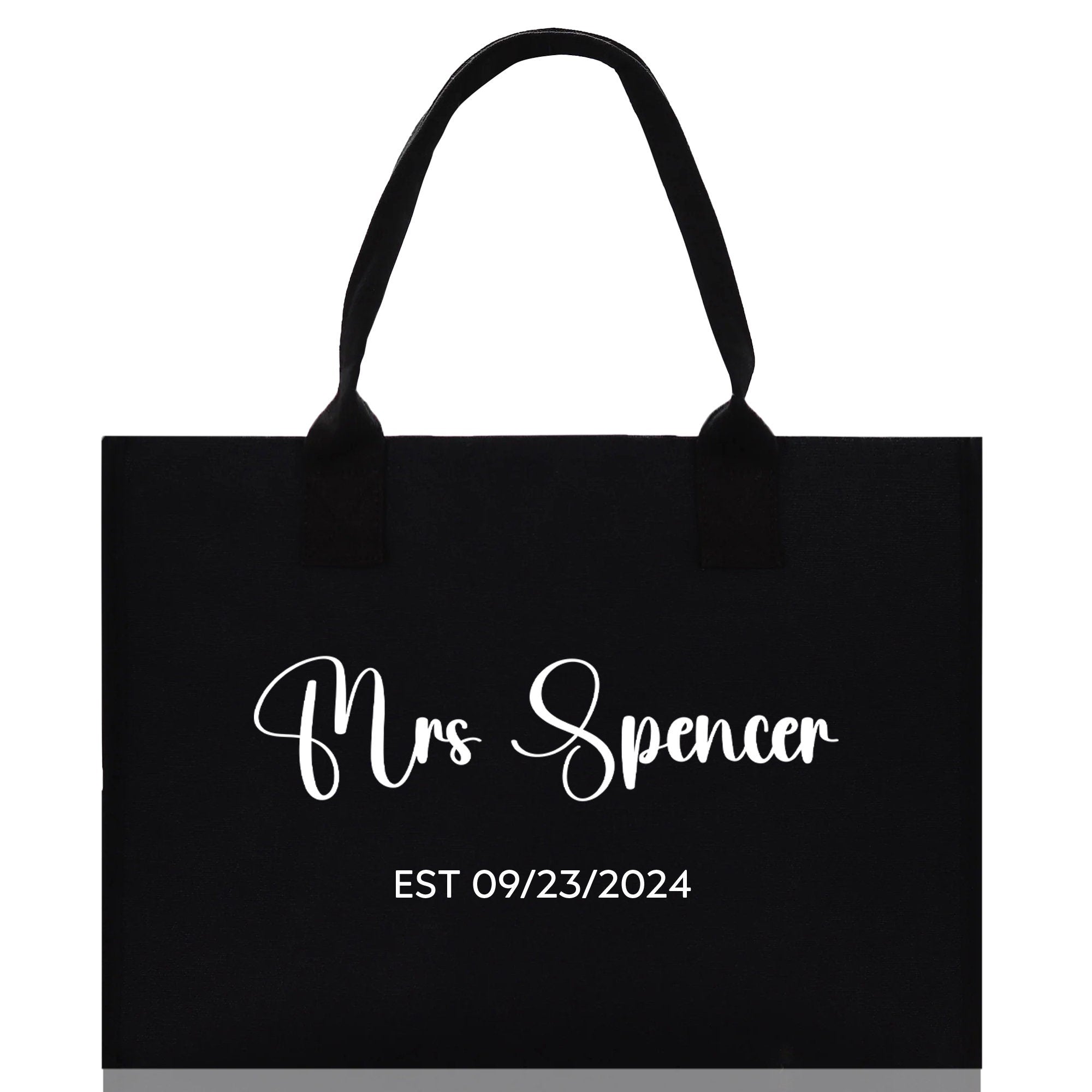 a black shopping bag with the words mrs spencer on it