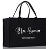 a black shopping bag with the words mrs spencer on it