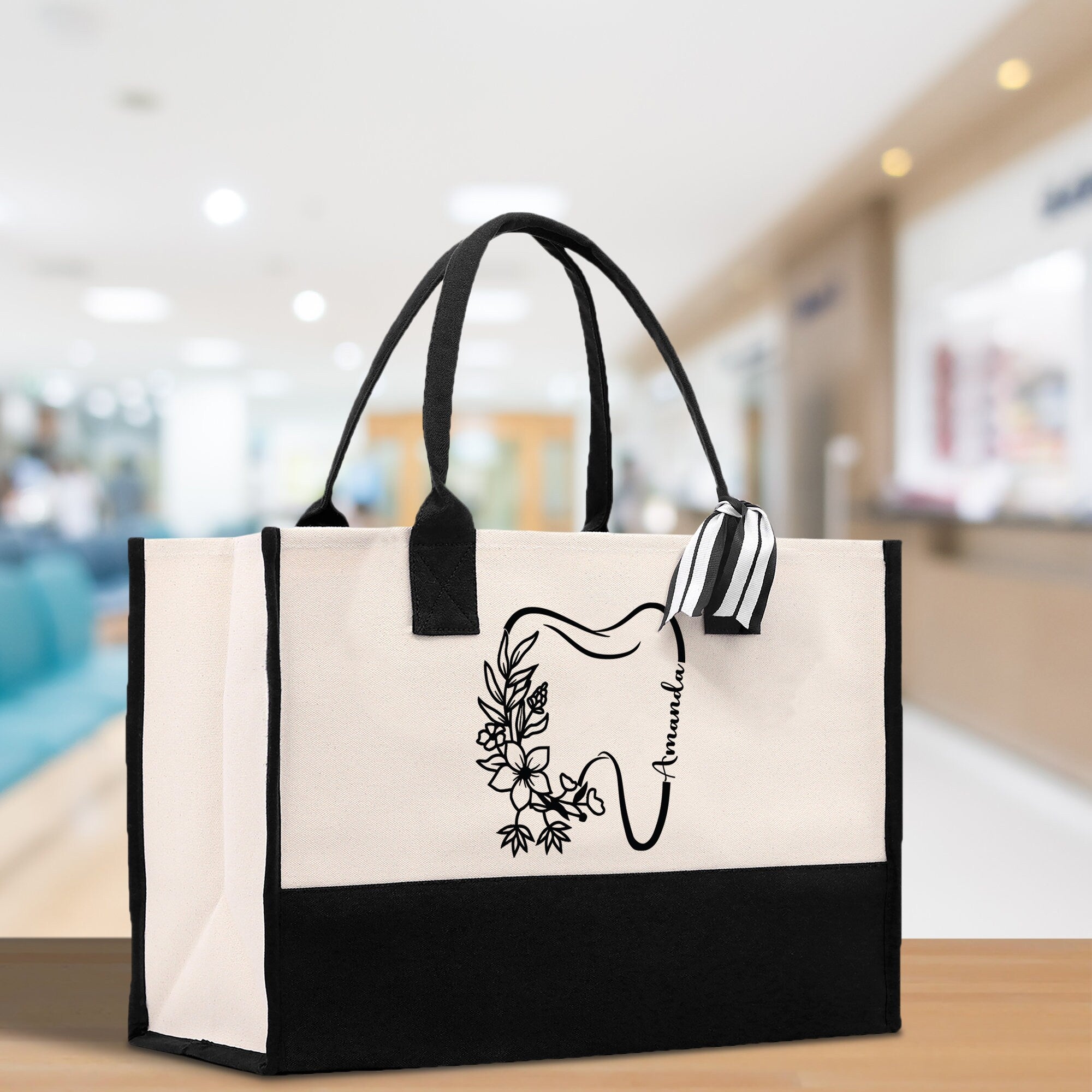a black and white bag with a picture of a woman&#39;s face on it