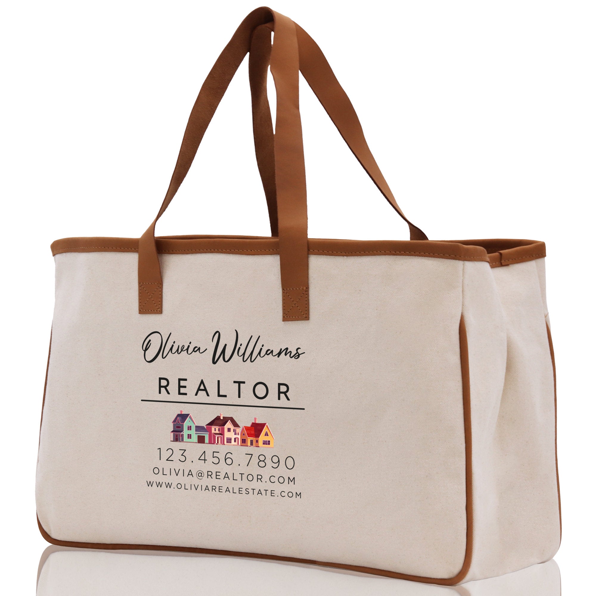 a white canvas bag with a brown leather handle
