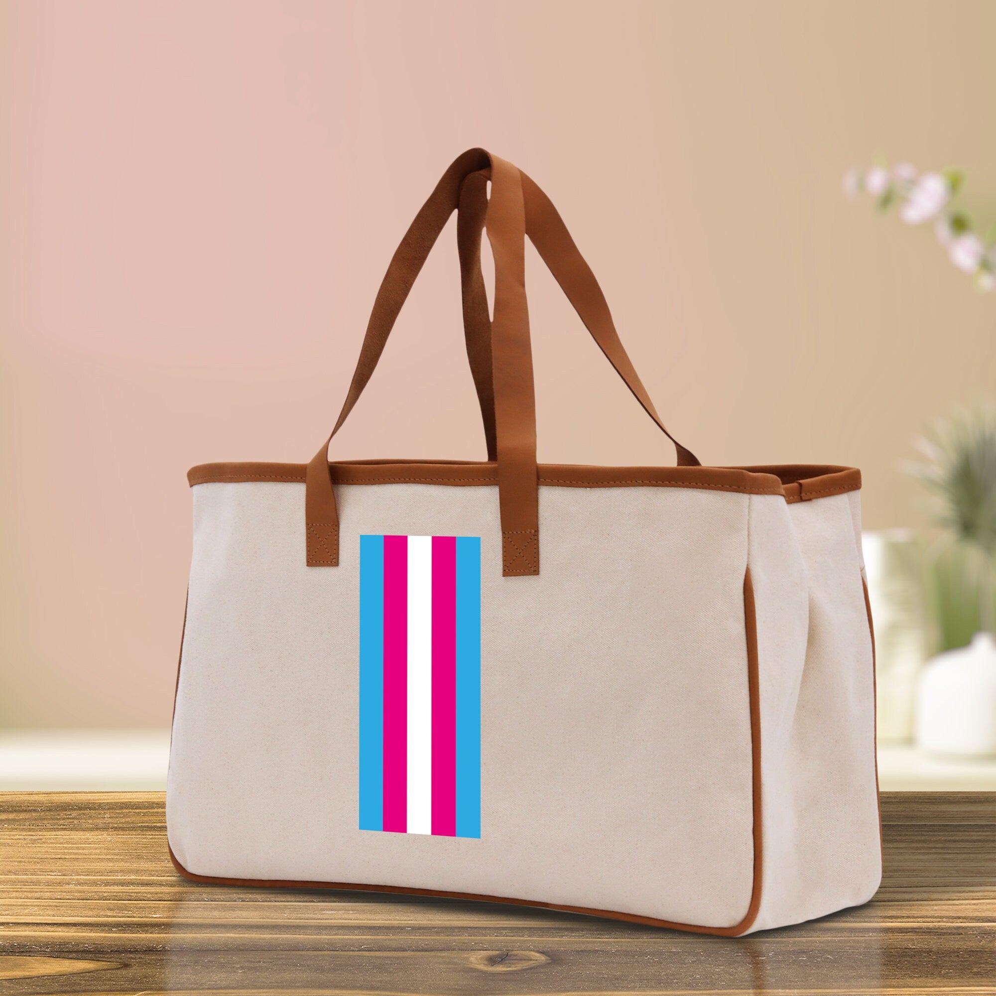 a canvas bag with a pink, blue, and white stripe on it