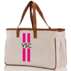 a canvas tote bag with a pink and white stripe