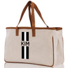 a canvas tote bag with a monogrammed stripe