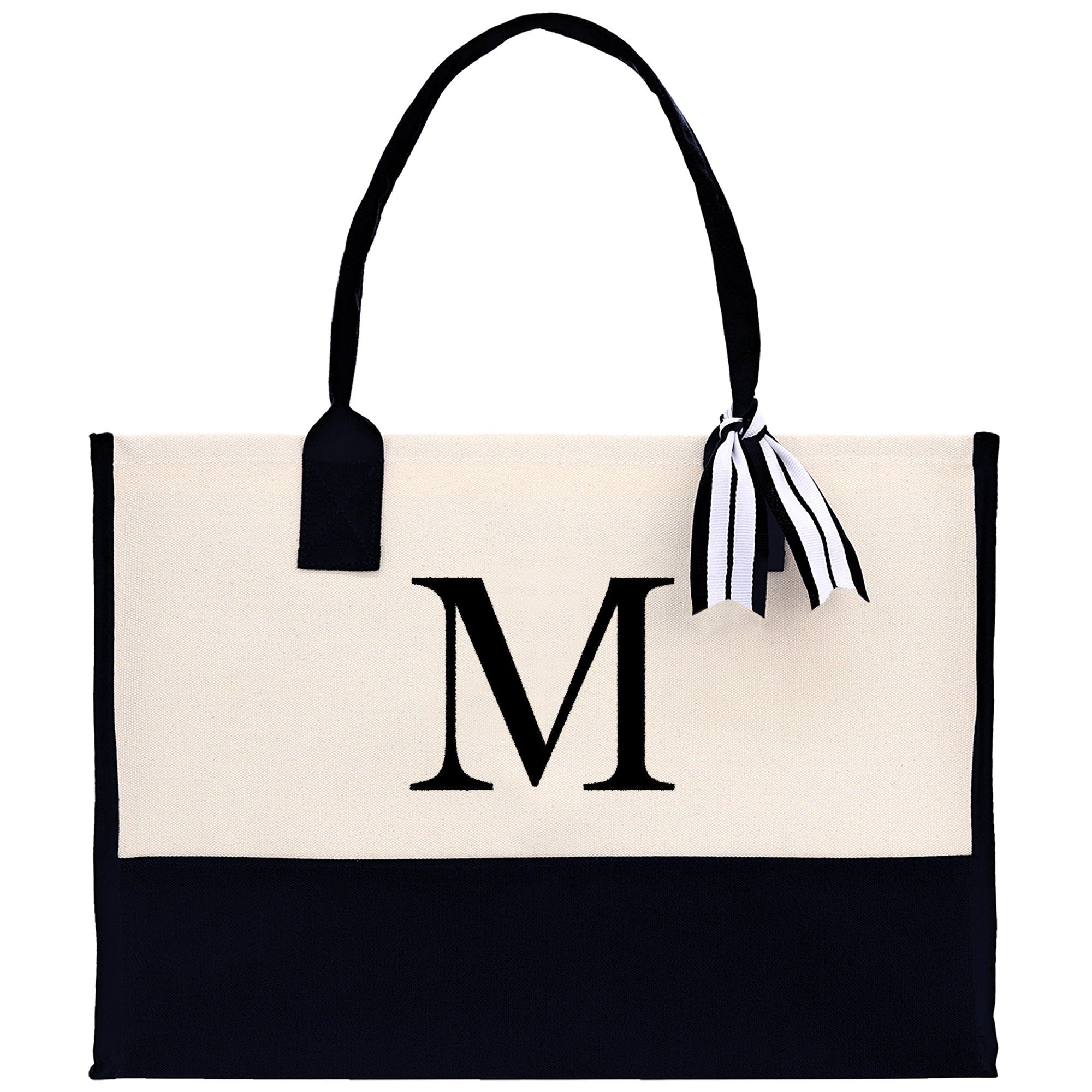 a black and white bag with a monogrammed m on it