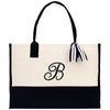 a black and white bag with a monogrammed letter