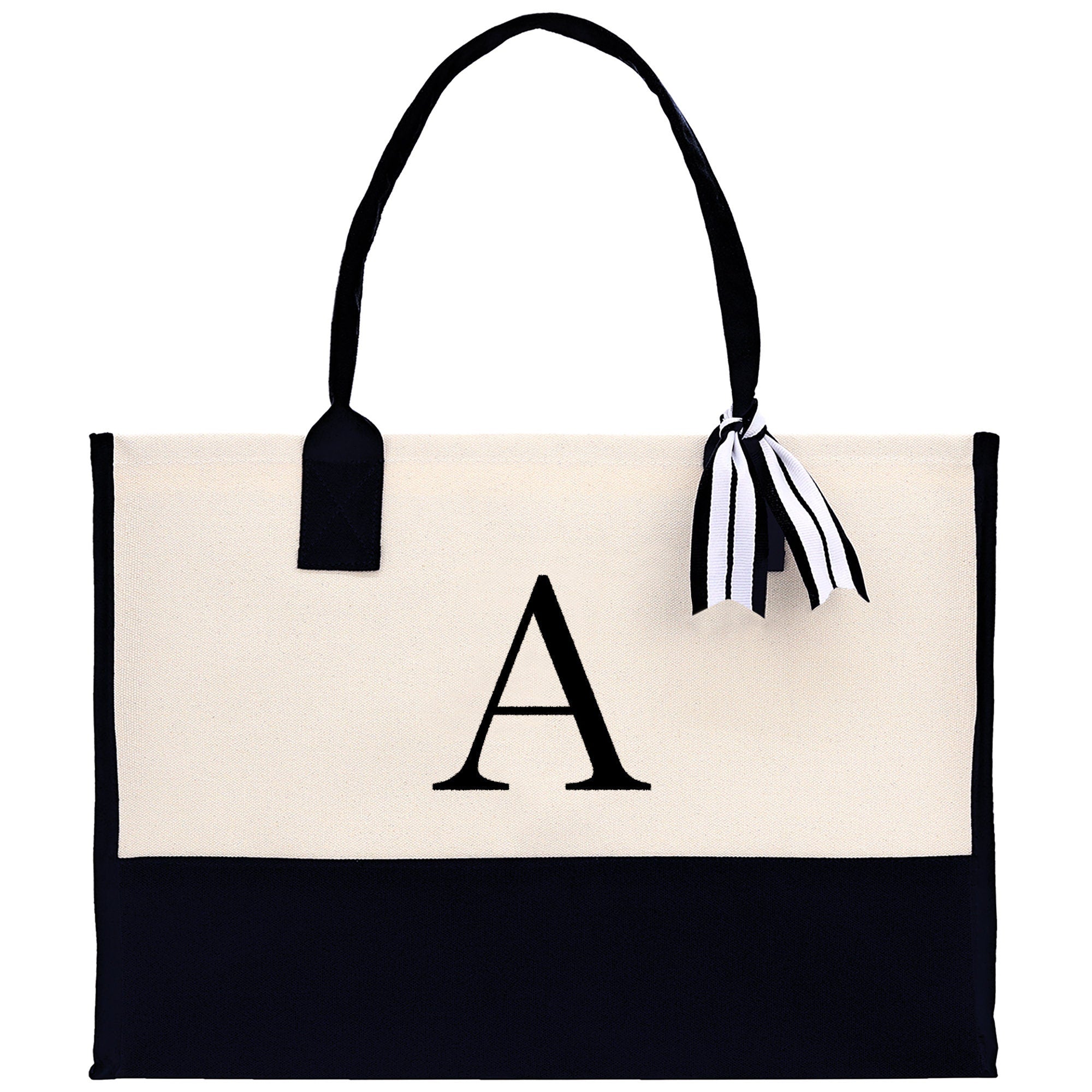 a black and white tote bag with a monogrammed letter