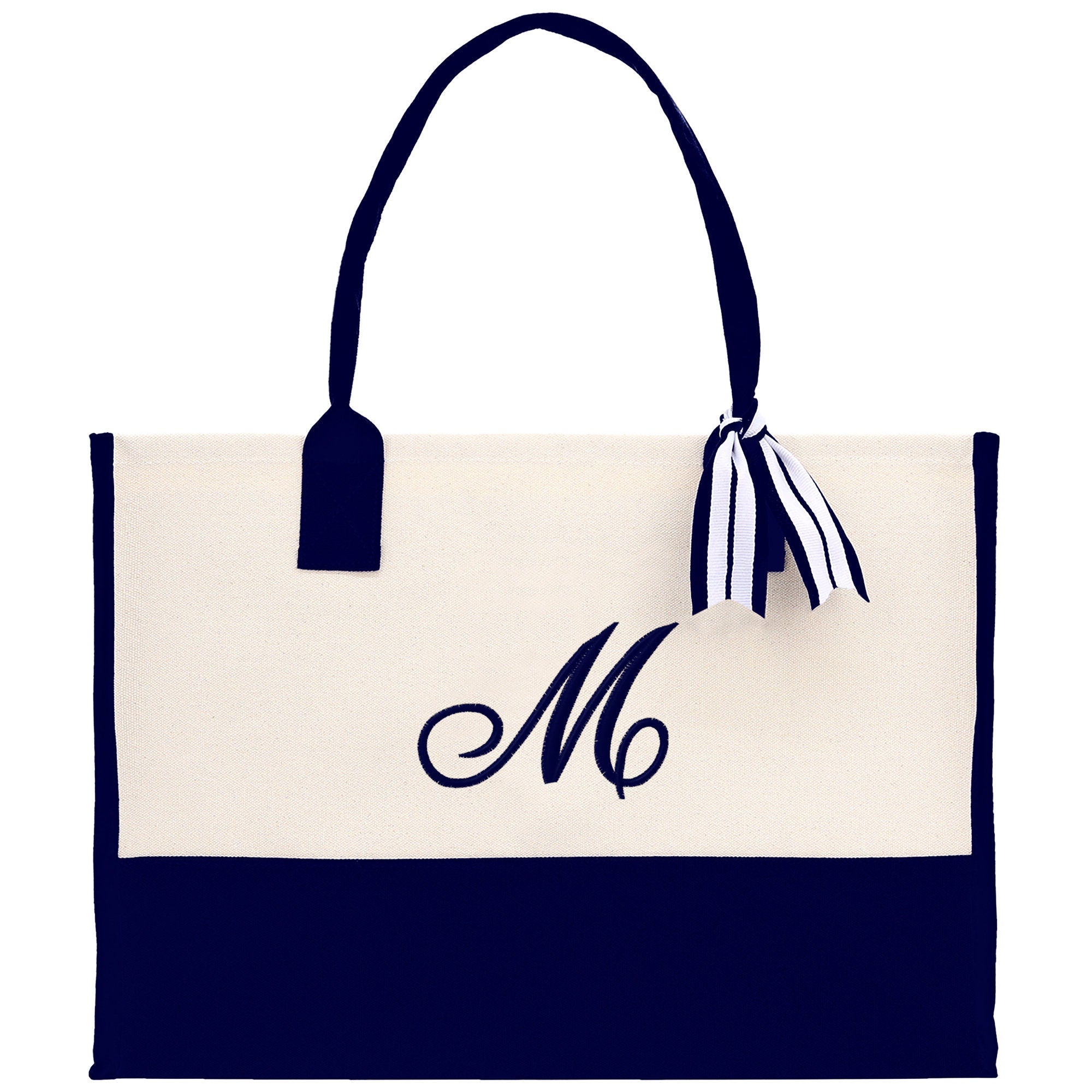 a white and black bag with a monogrammed m on it