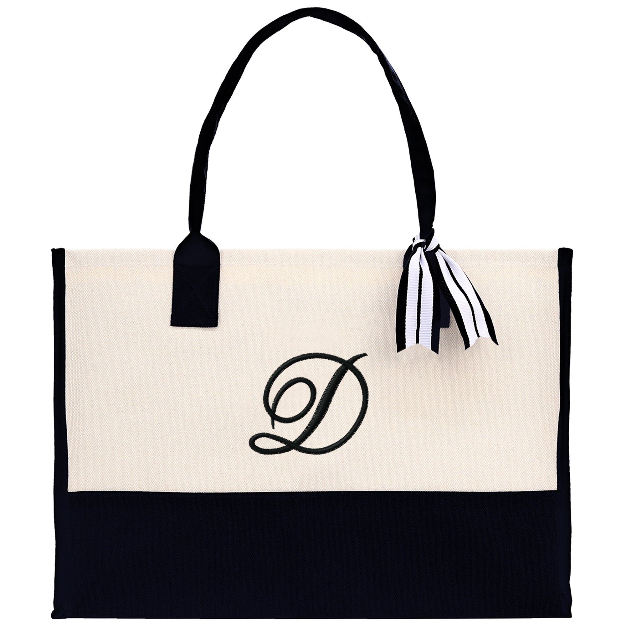 a black and white tote bag with a monogrammed letter d