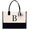 a black and white tote bag with a monogrammed b on the front