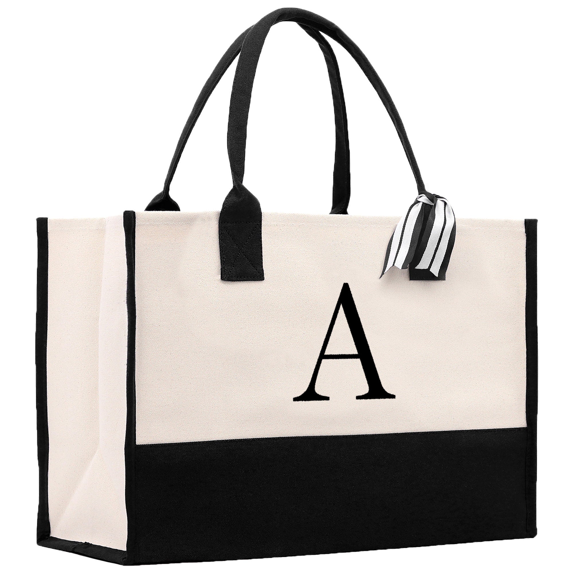 a black and white tote bag with a monogrammed letter