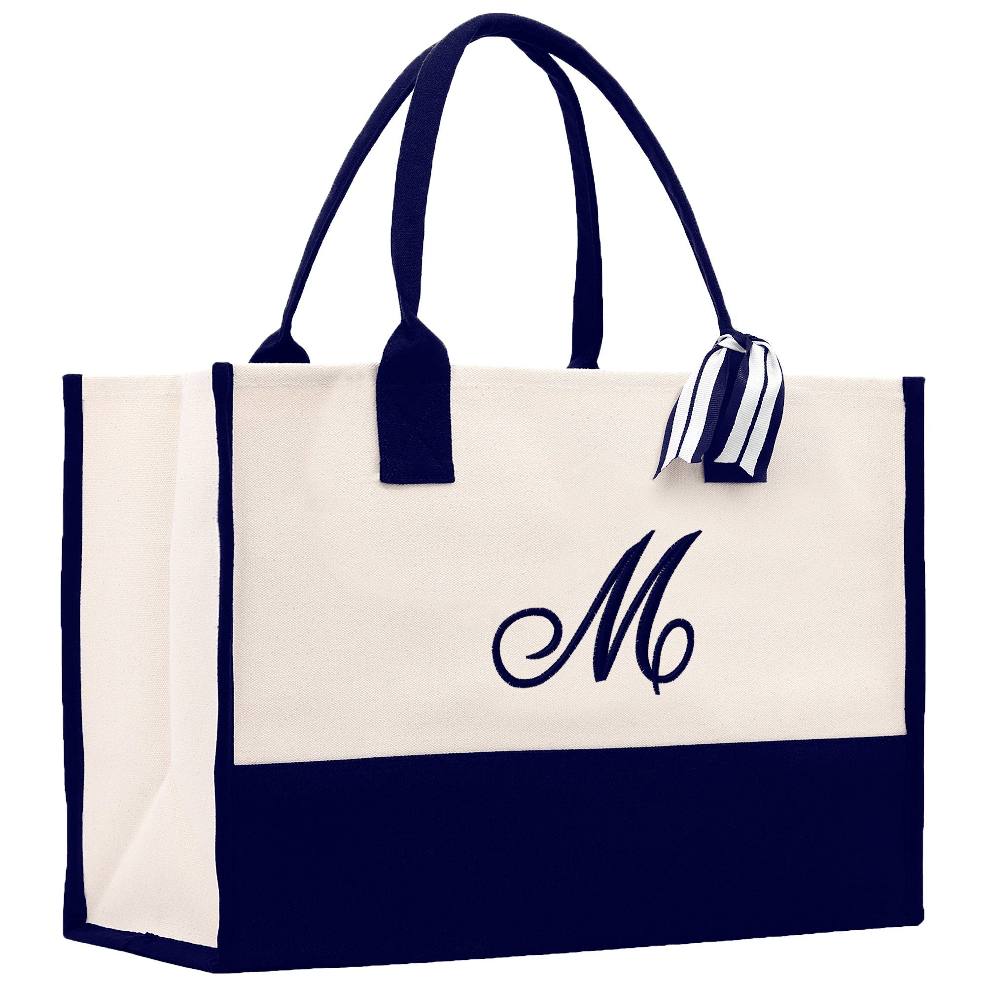 a white and black bag with a monogrammed m on it