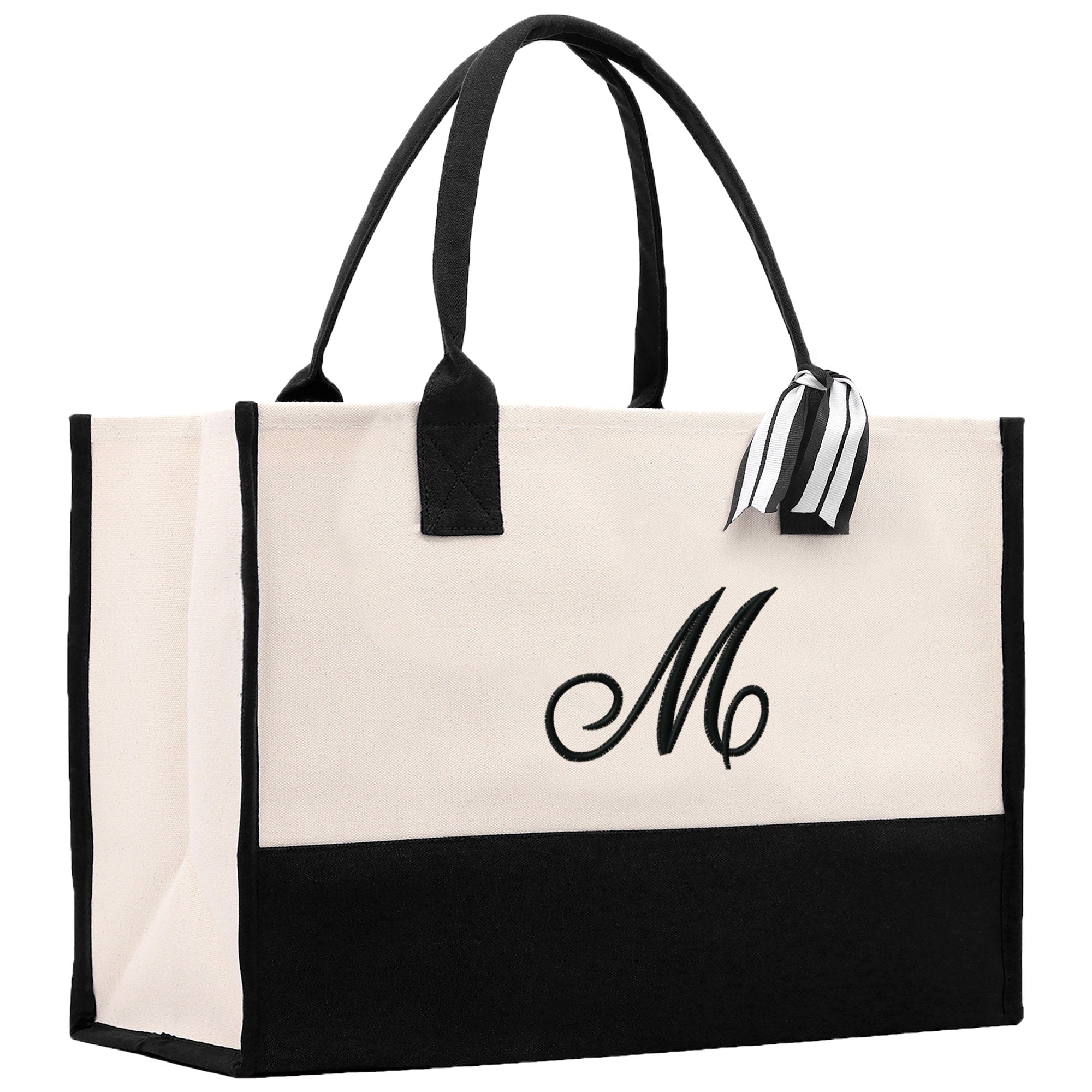 a black and white bag with a monogrammed m on it