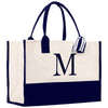 a black and white bag with a monogrammed m on it