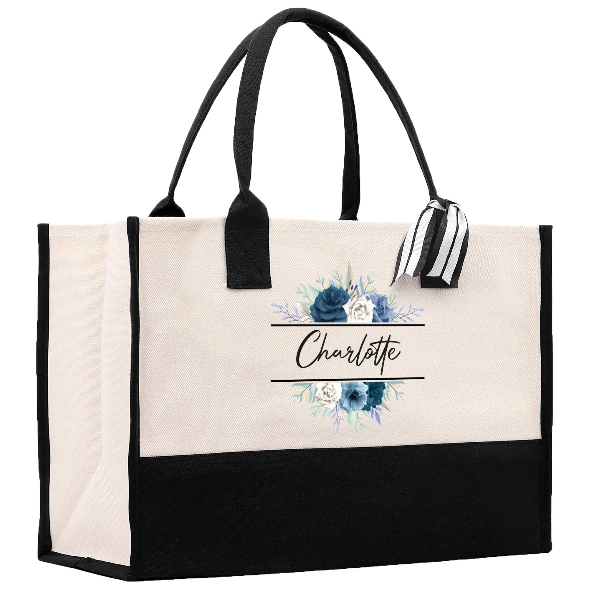 a black and white tote bag with blue flowers