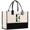 a black and white tote bag with a monogrammed initial