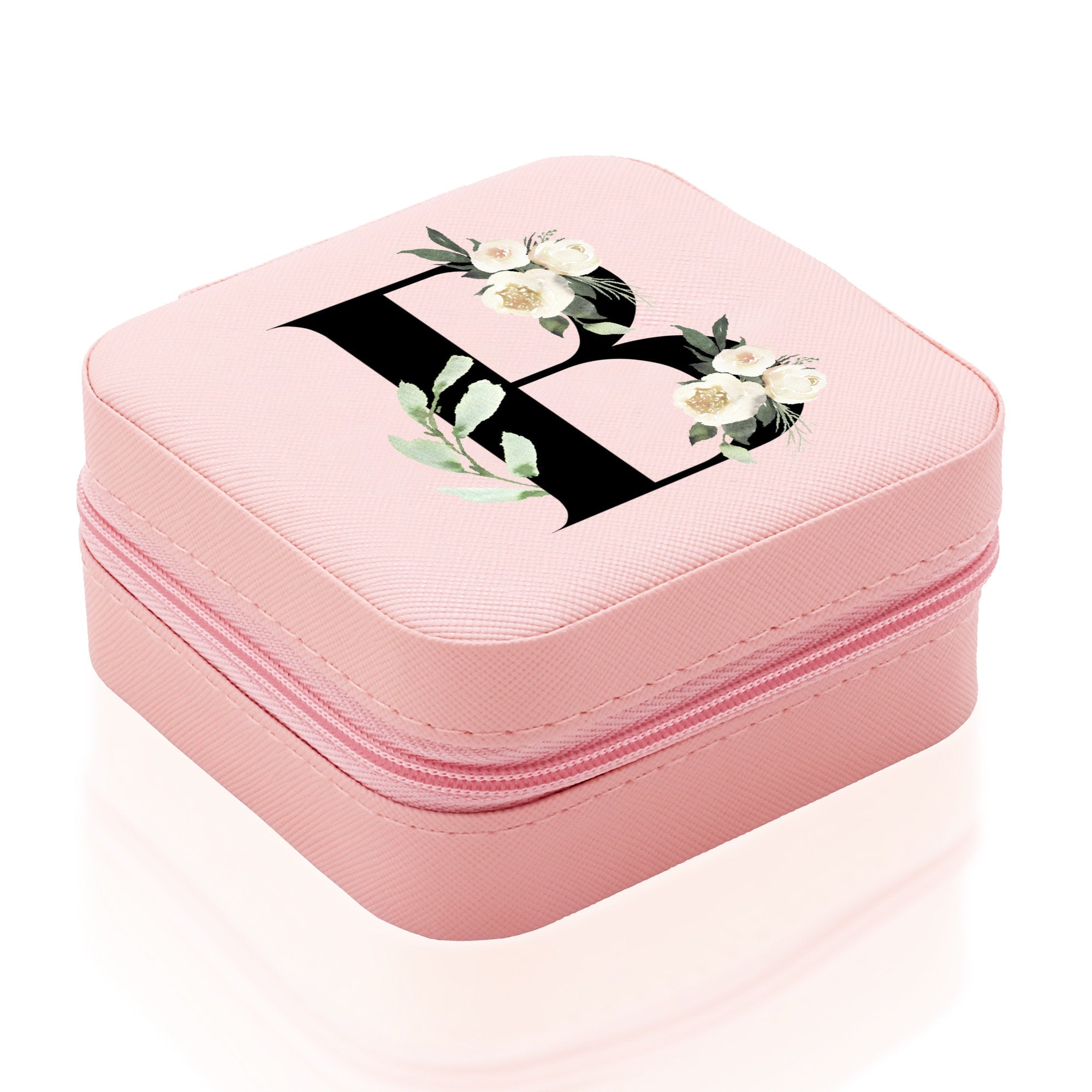 a pink case with flowers on it on a white background