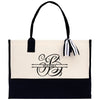 a black and white tote bag with a monogrammed initial