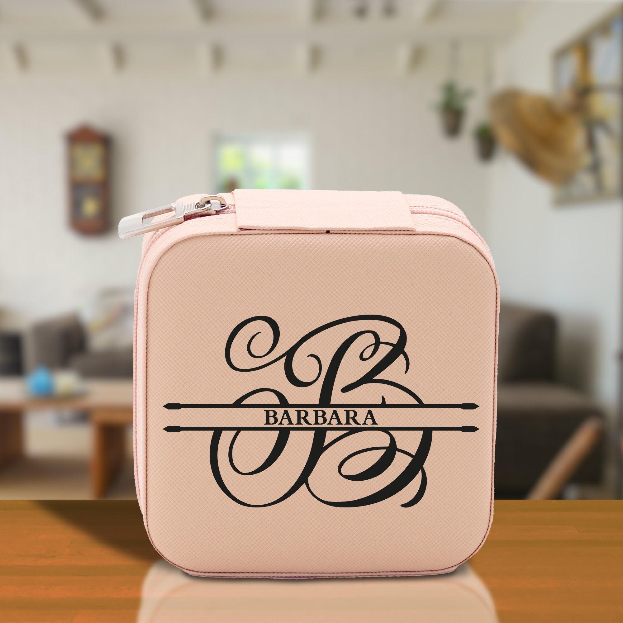 a pink lunch box sitting on top of a wooden table