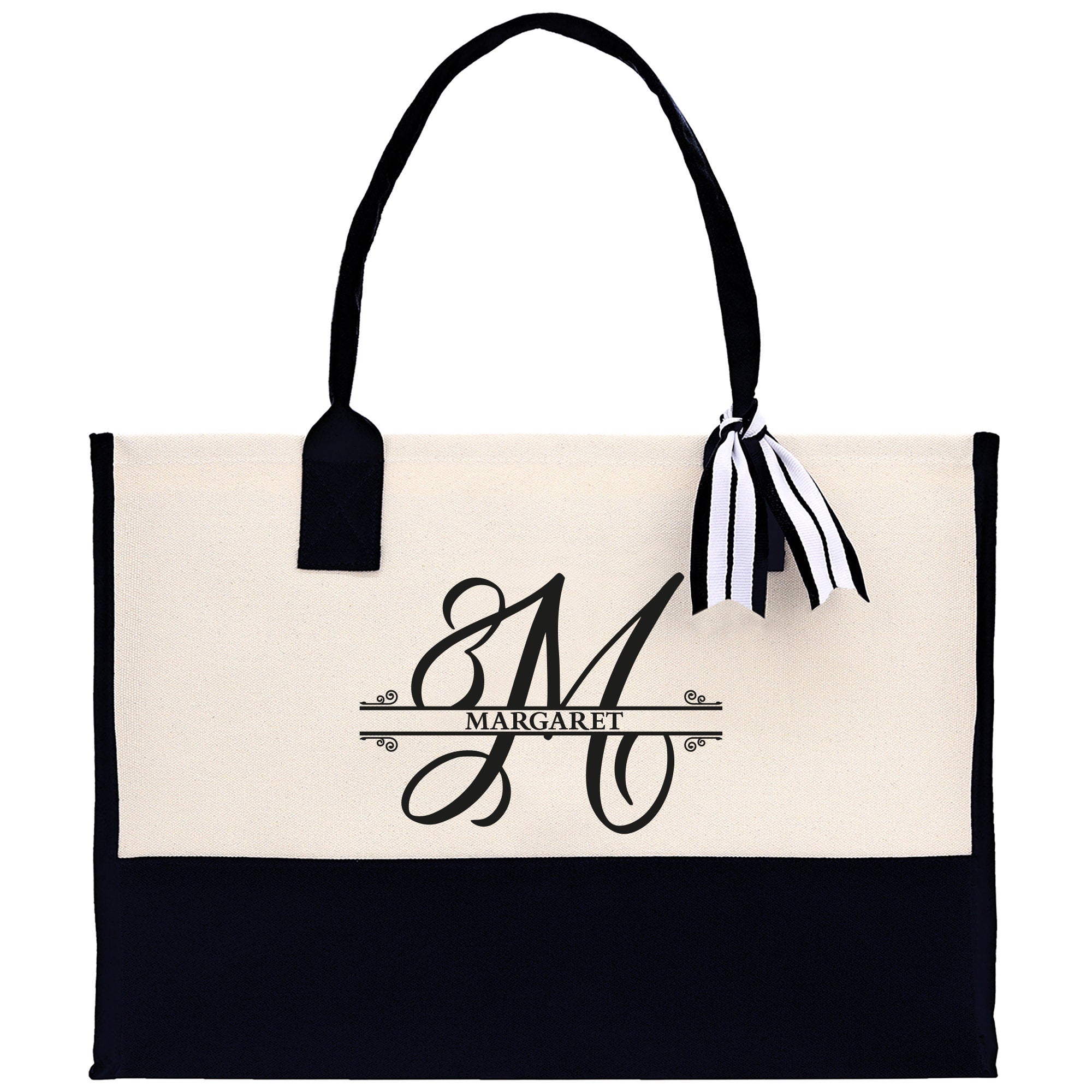 a black and white tote bag with a monogrammed m on it